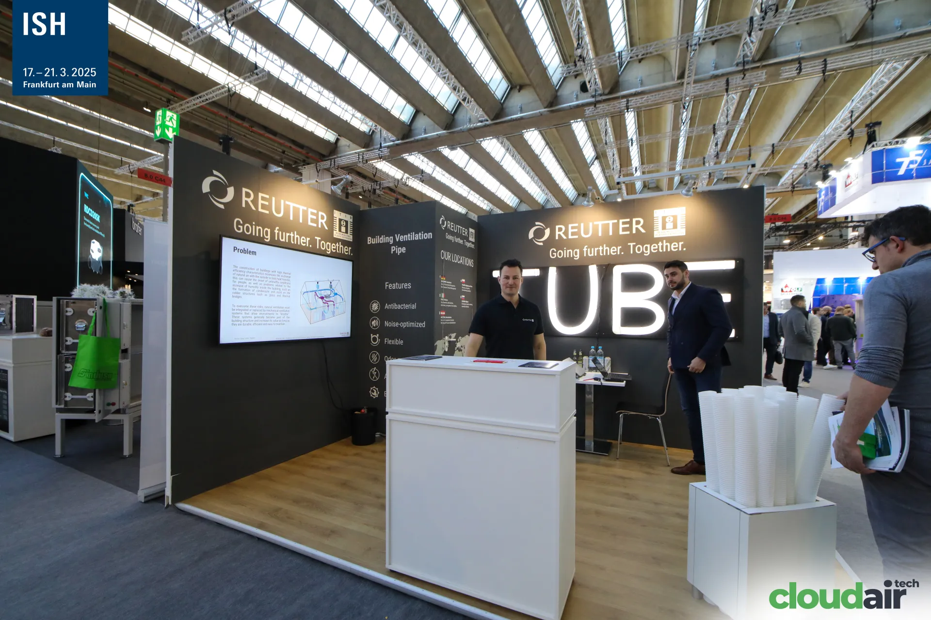 Reutter stand with illuminated "TUBE" letters and ventilation pipe display at ISH 2025