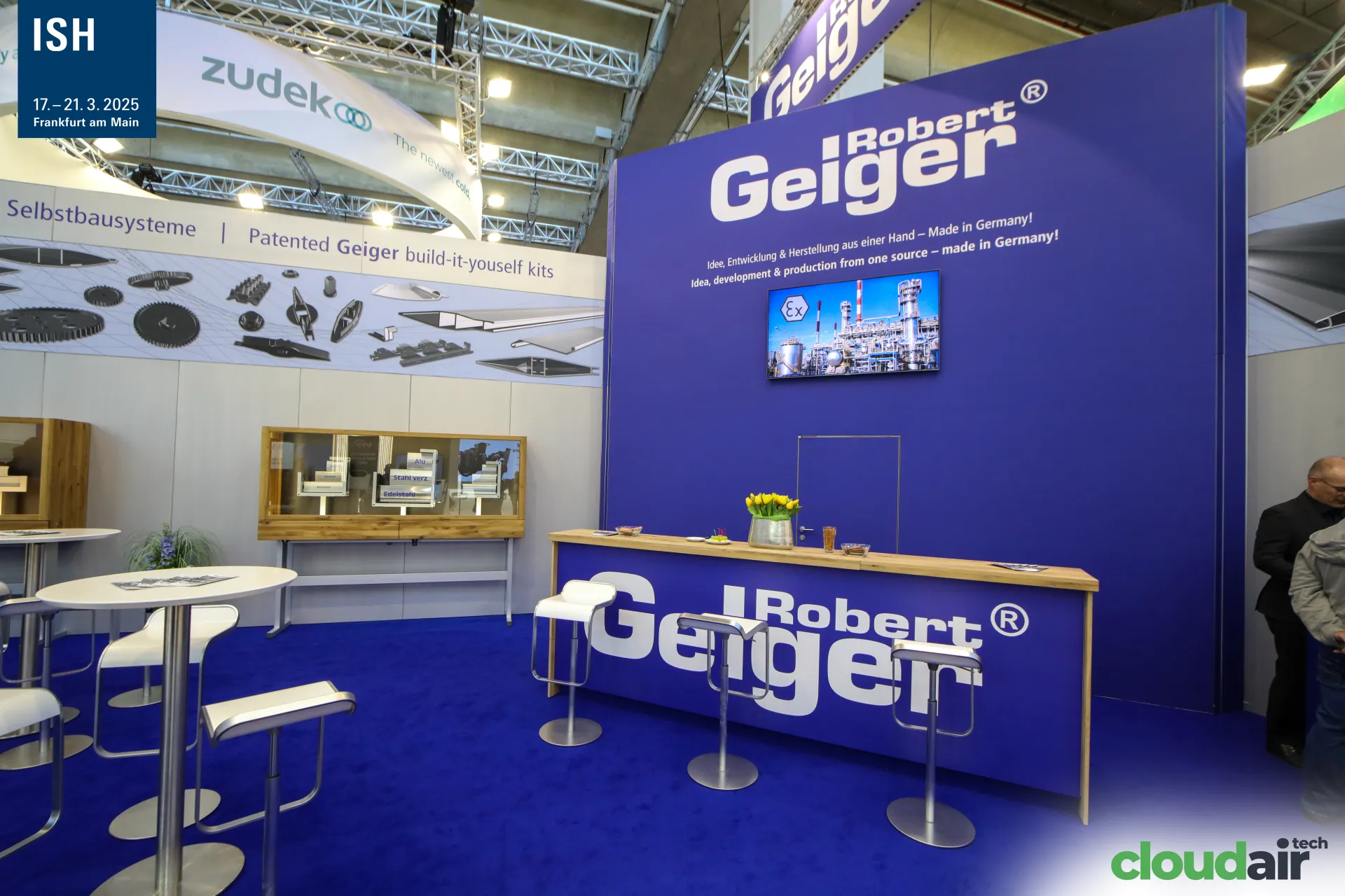 Robert Geiger bar counter and blue brand wall with Made in Germany slogan at ISH 2025
