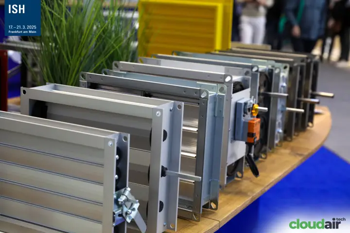 Row of aluminium and steel dampers with actuators on a wooden counter