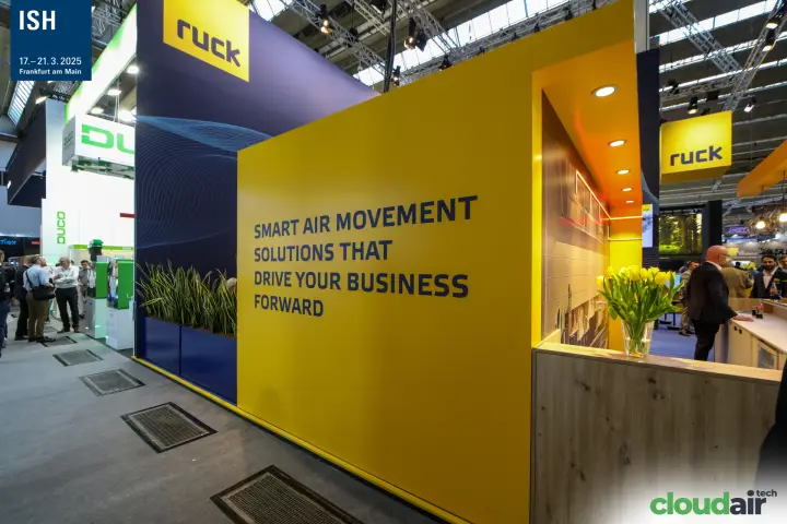 Ruck slogan wall and planters along the aisle side of the stand at ISH 2025