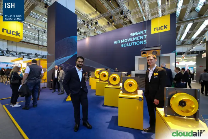 Ruck staff beside a row of yellow centrifugal fan impellers at ISH 2025
