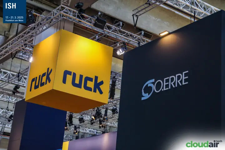 Ruck yellow cube and O.Erre logo on a dark stand wall at ISH 2025
