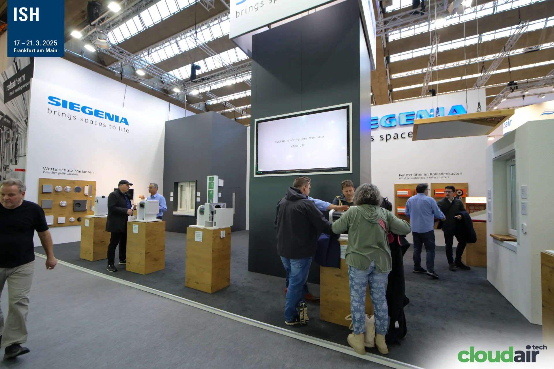 Siegenia stand with wall ventilators on wooden plinths at ISH 2025