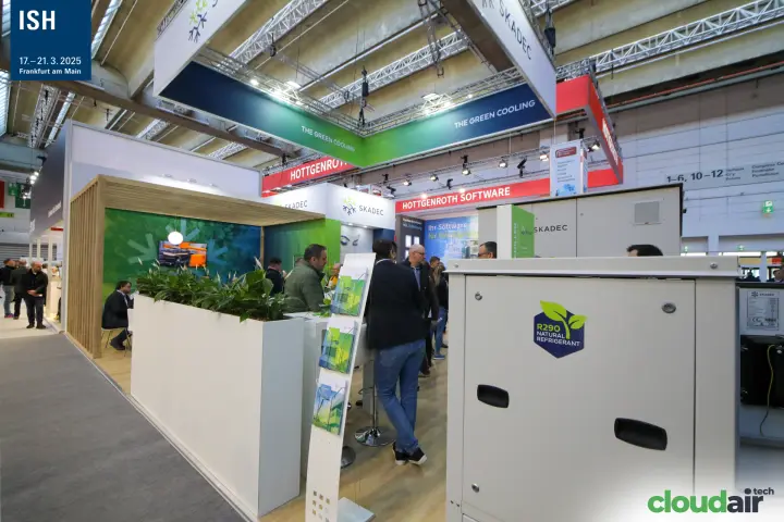 Skadec R290 unit in front of "THE GREEN COOLING" overhead banner