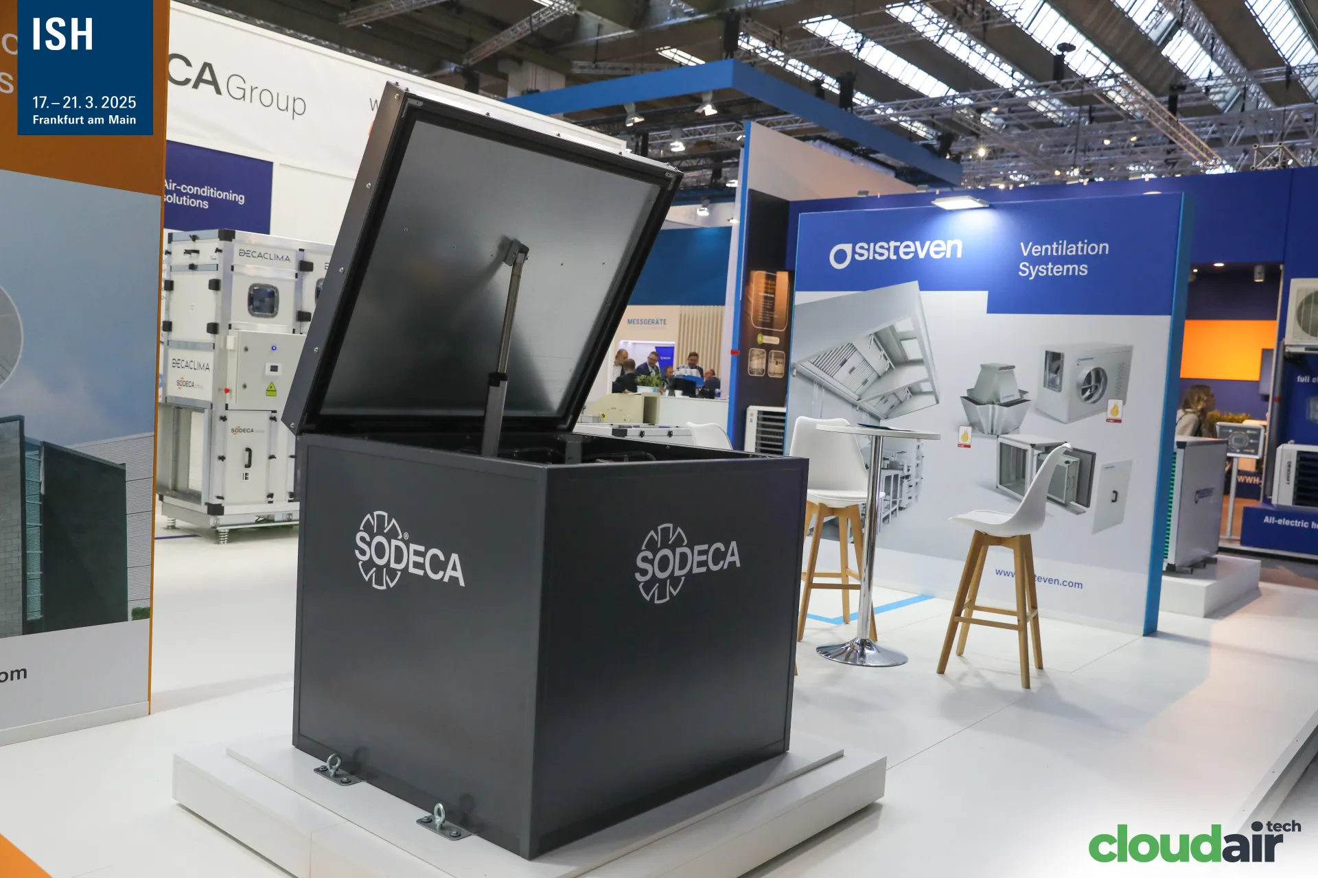 Sodeca charcoal enclosure with raised lid beside the Sisteven wall at ISH 2025