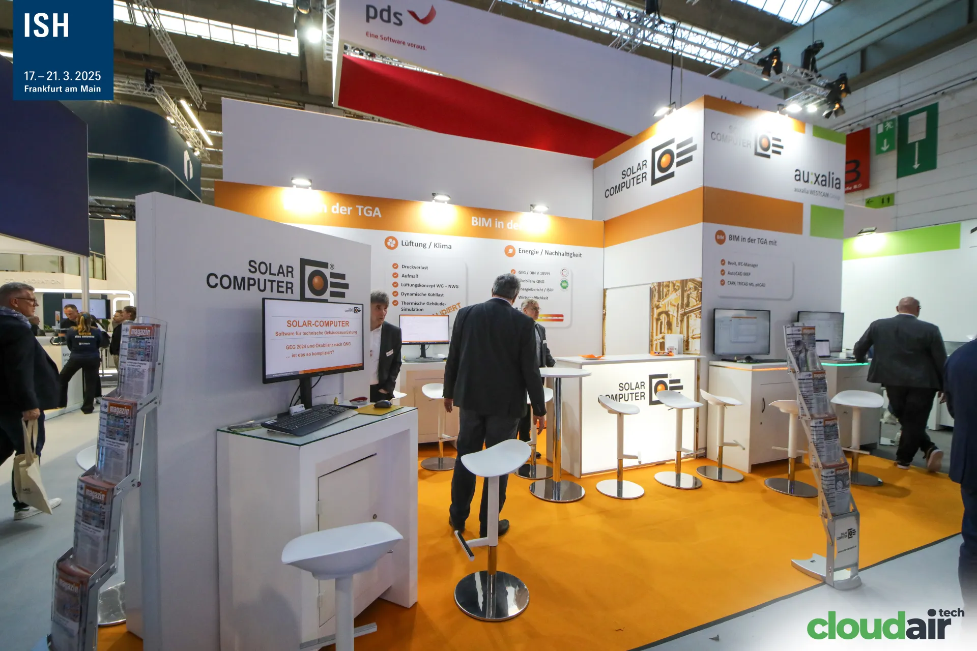 Solar-Computer stand with orange carpet and TGA software topics at ISH 2025