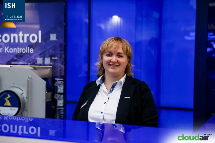 Staff member at the blue Ziehl-Abegg counter at ISH 2025