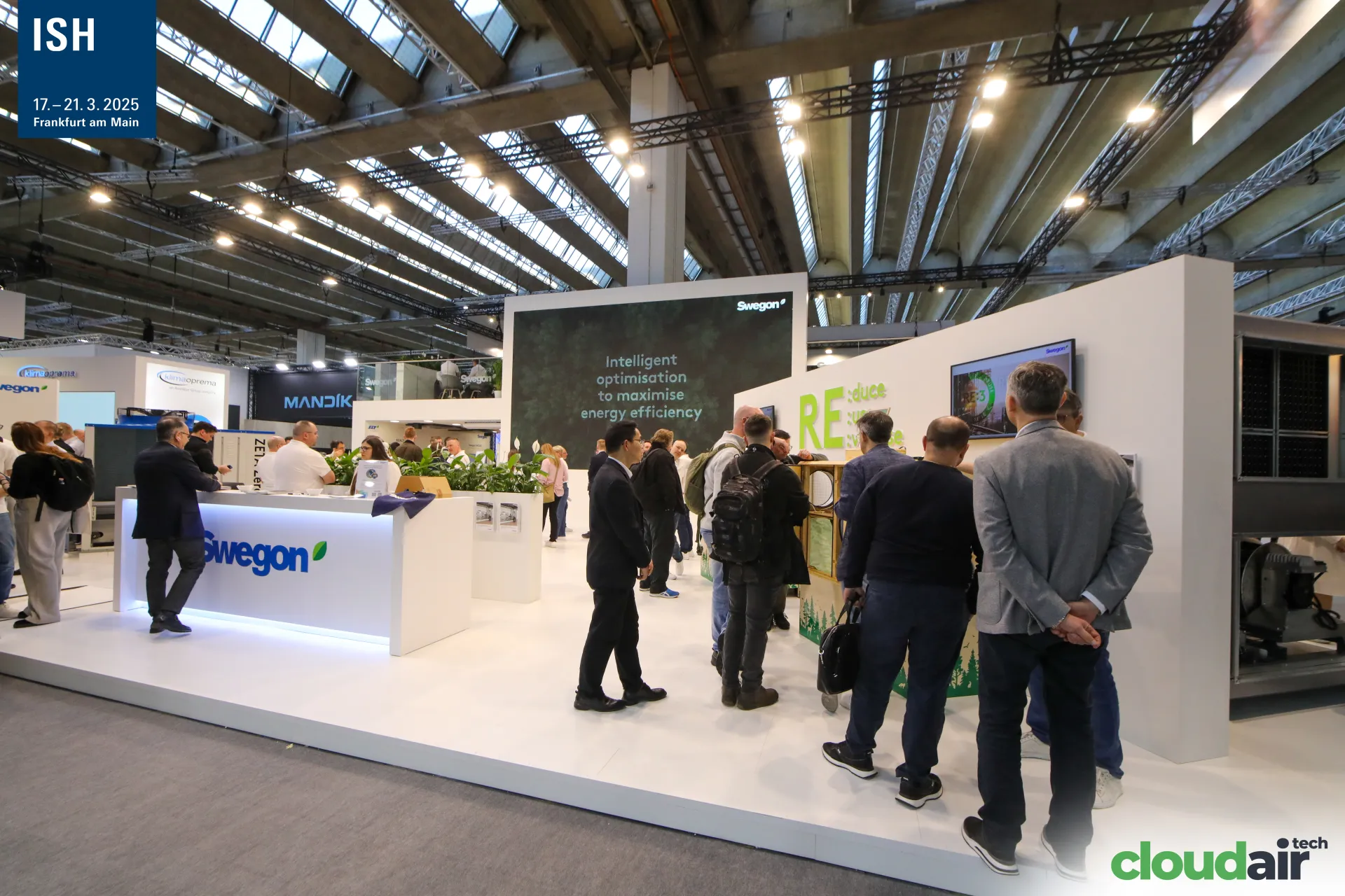 Swegon 'Intelligent optimisation' screen above a busy stand at ISH 2025