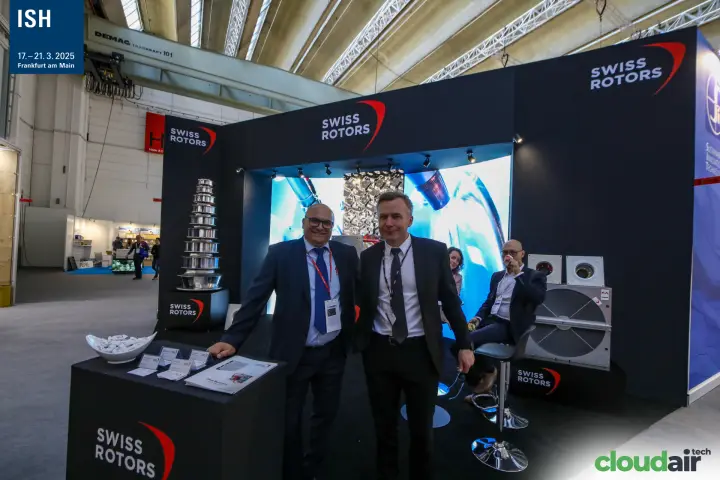 Swiss Rotors team at the counter with heat recovery wheel behind