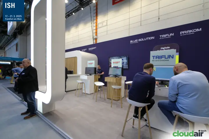 Taifun and M-Soft workstations along the purple OneQrew wall at ISH 2025