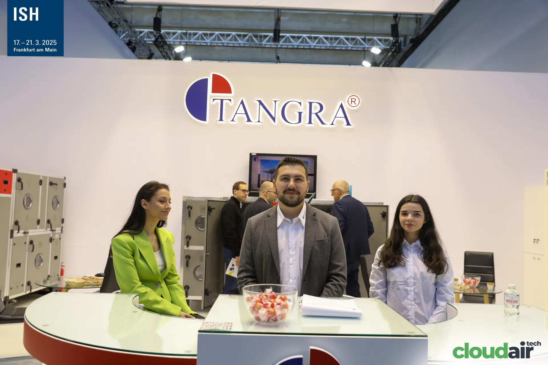Tangra team at the reception desk with AHUs behind at ISH 2025