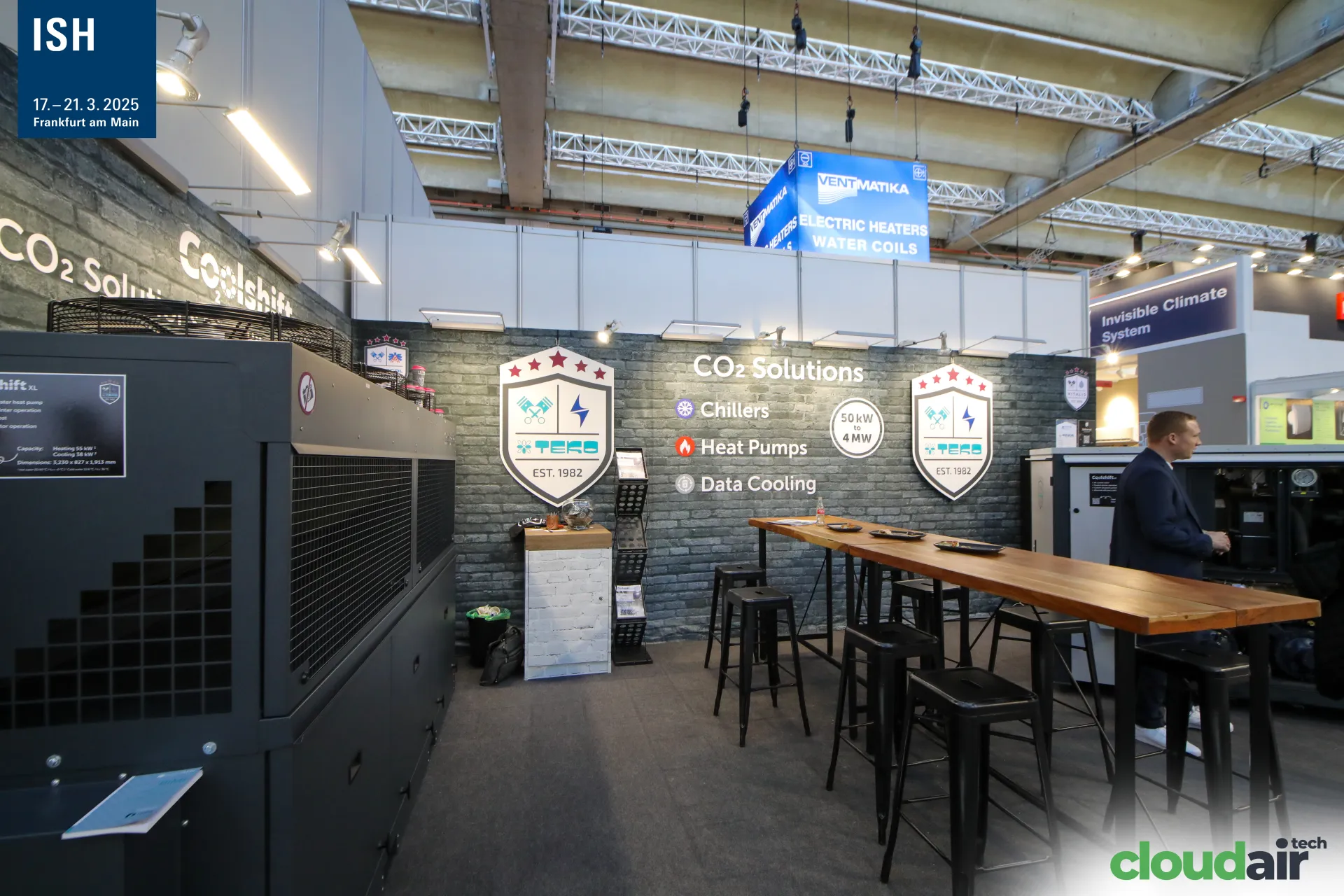 TEKO Coolshift CO2 unit and brick-effect wall listing chillers and heat pumps at ISH 2025