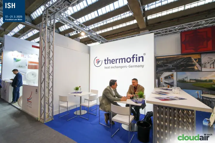 Thermofin stand with meeting tables and a finned-tube counter at ISH 2025