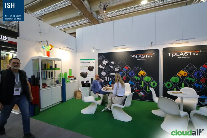Tplast S.A. stand with corrugated pipe graphics and green carpet