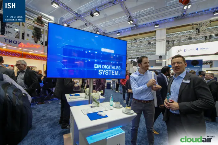 TROX digital system screen next to white demo workstations at ISH 2025