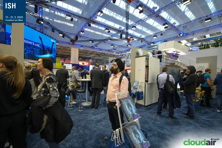 TROX stand interior with a tall ventilation unit and high bar tables at ISH 2025