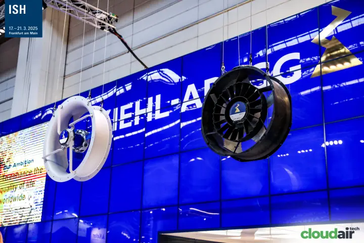 Two axial fans suspended in front of the blue Ziehl-Abegg facade at ISH 2025