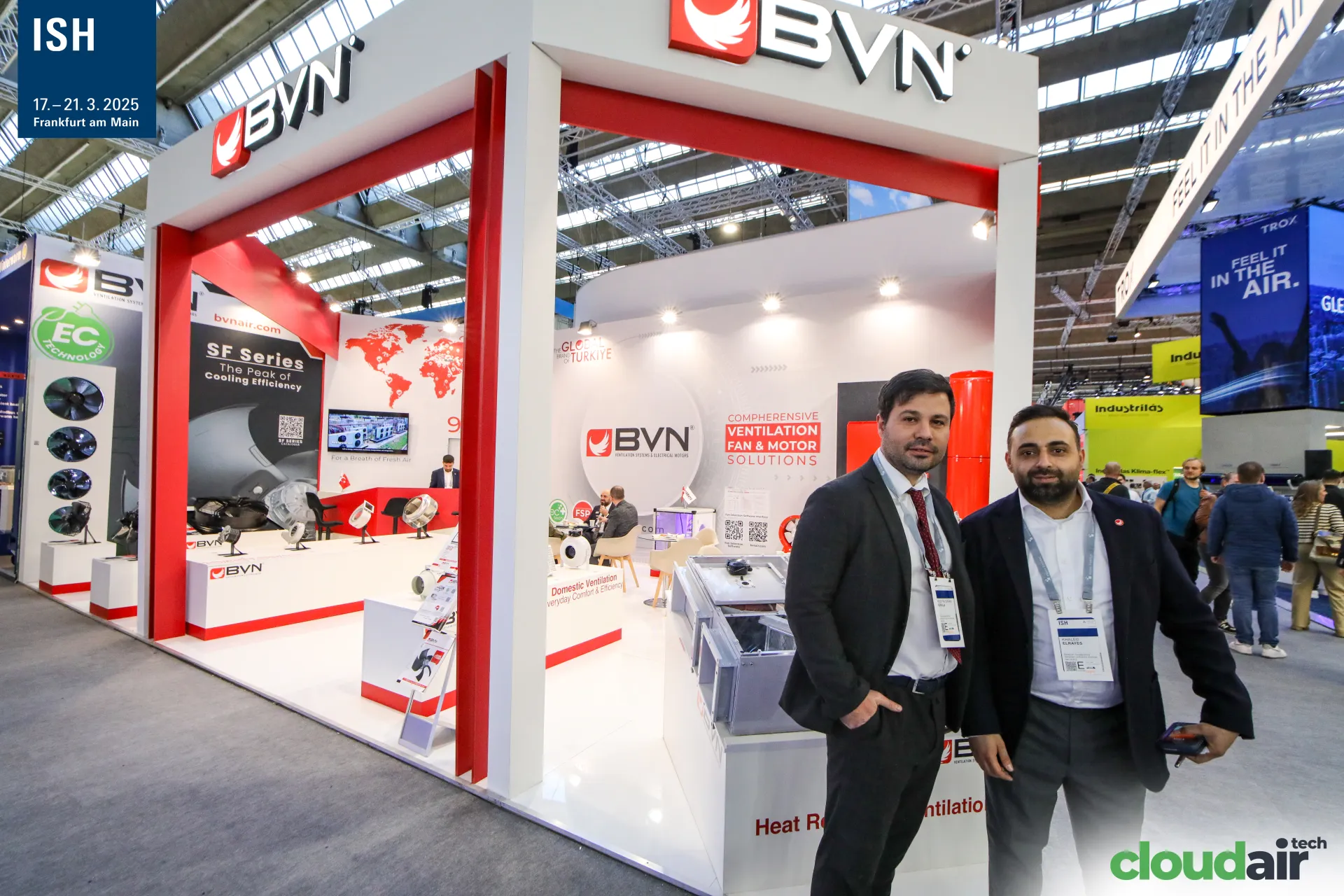 Two exhibitors in front of the BVN fan and HRV stand at ISH 2025
