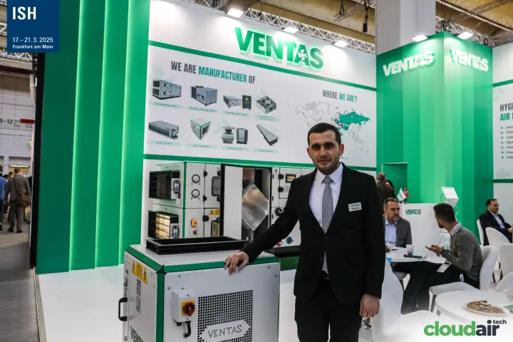 Ventas staff with a compact unit under the 'We are manufacturer of' wall at ISH 2025