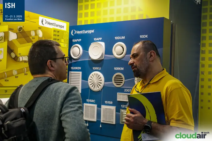 VentEurope air valves and grilles board during a stand conversation at ISH 2025