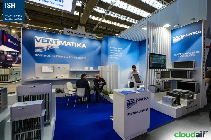 Ventmatika counter with catalogue kiosk beside water heaters and coolers at ISH 2025