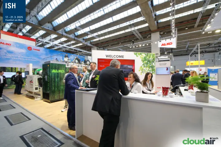 Visitors at the AL-KO and Trane welcome desk at ISH 2025