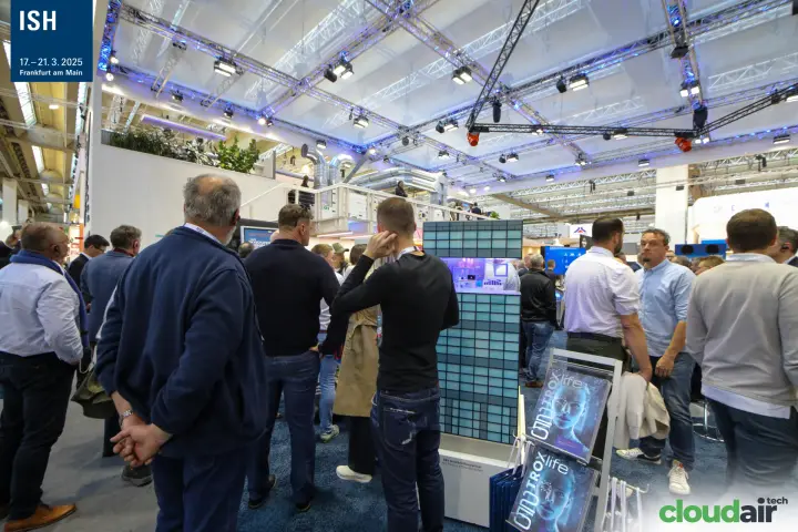 Visitors around a TROX tower model of a pressure ventilation system at ISH 2025