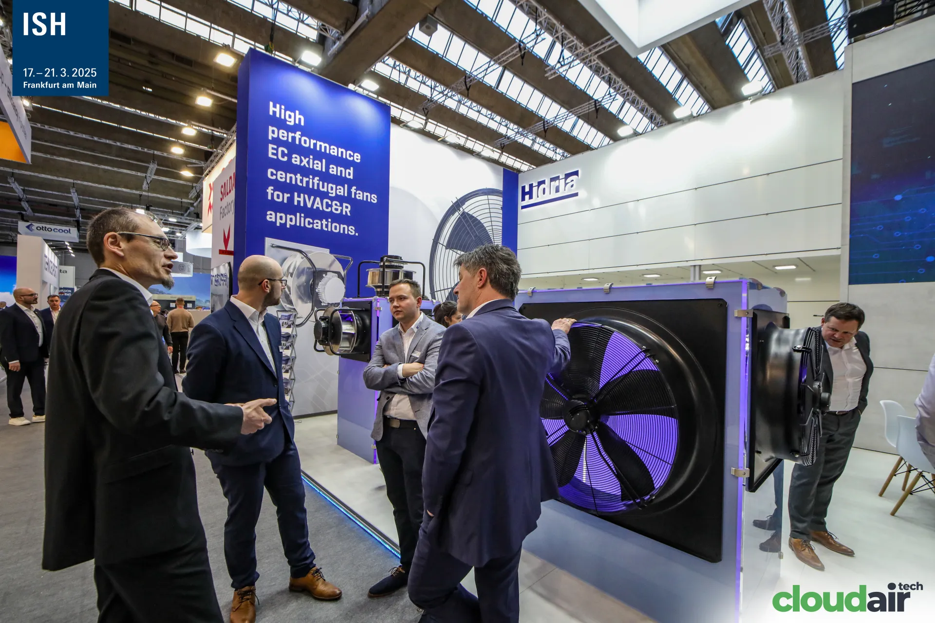 Visitors discussing a large axial EC fan on the Hidria stand at ISH 2025