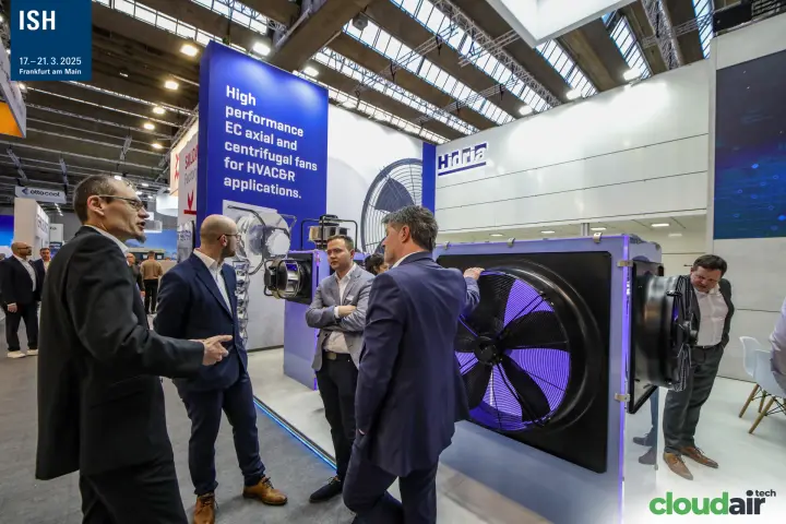 Visitors discussing a large axial EC fan on the Hidria stand at ISH 2025