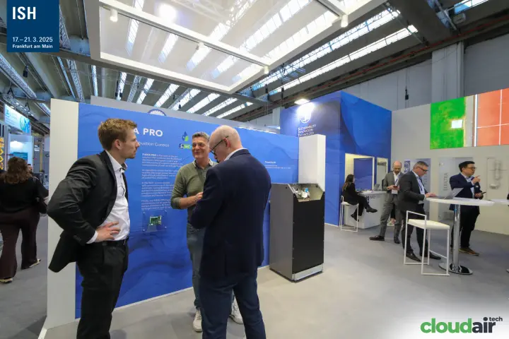 Visitors in discussion at the SIT FLEXA PRO combustion control wall