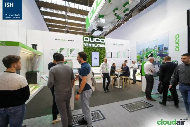 Visitors at the Duco stand between Natural and Energy Family walls