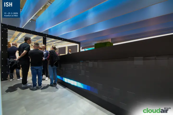 Visitors at the entrance of the Robatherm meeting area beside the LED wall at ISH 2025