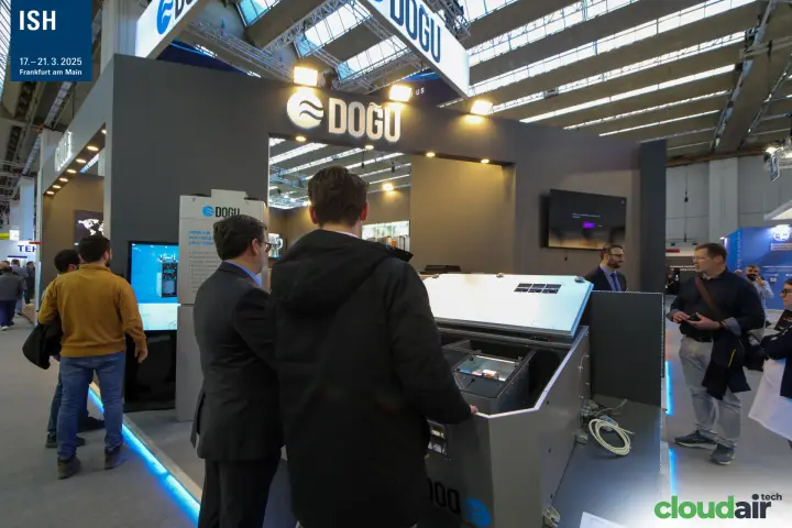 Visitors examining an open Doğu unit at the front of the stand at ISH 2025