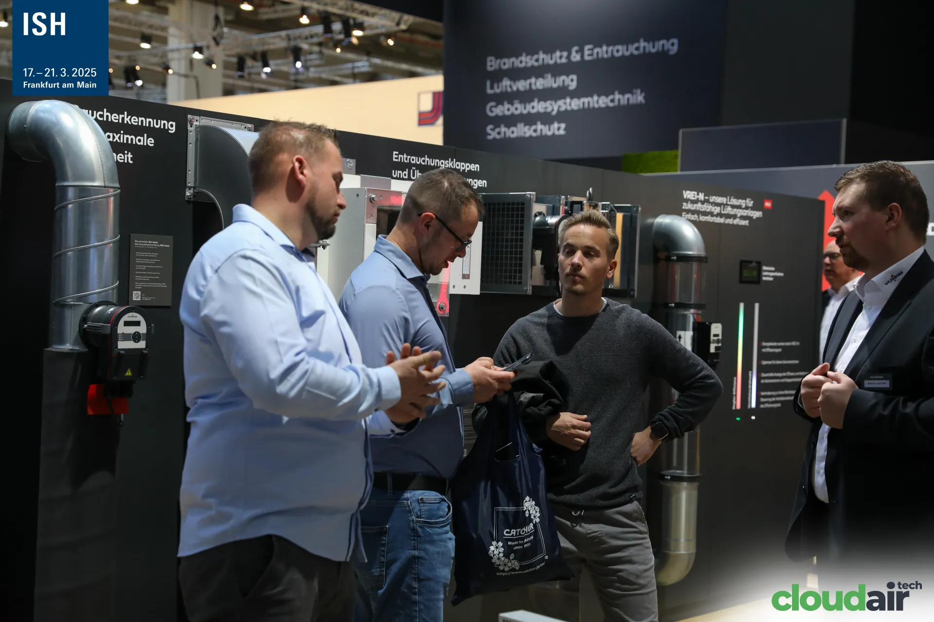 Visitors in front of Wildeboer smoke extraction damper wall at ISH 2025