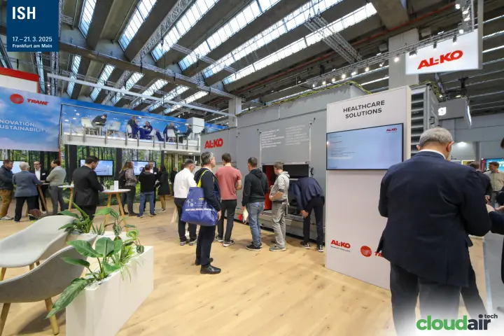 Visitors inspect a large AL-KO air handling unit at the stand at ISH 2025