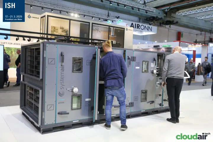 Visitors inspecting an open Systemair Geniox air handling unit
