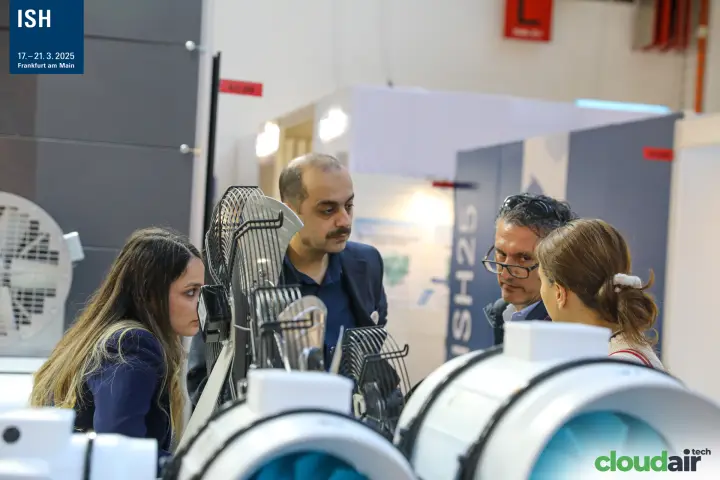 Visitors looking at axial fans behind Kayi inline fans at ISH 2025