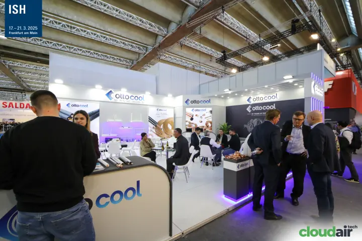 Visitors and staff at the Ottocool counter and lounge at ISH 2025
