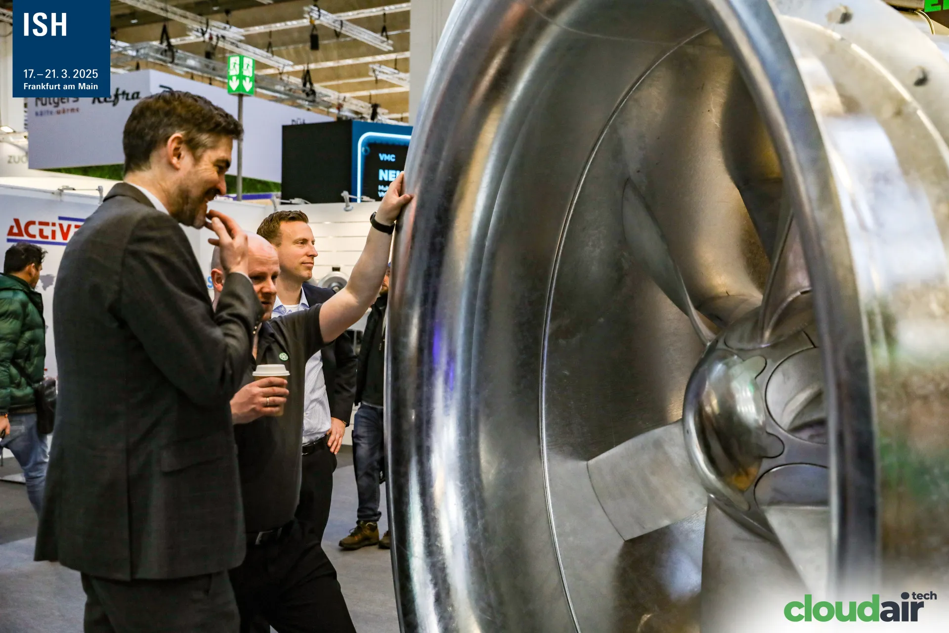 Visitors studying the hub and blades of a large Novenco axial fan at ISH 2025