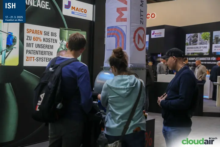 Visitors try a fan demo promoting the Maico ZITT system