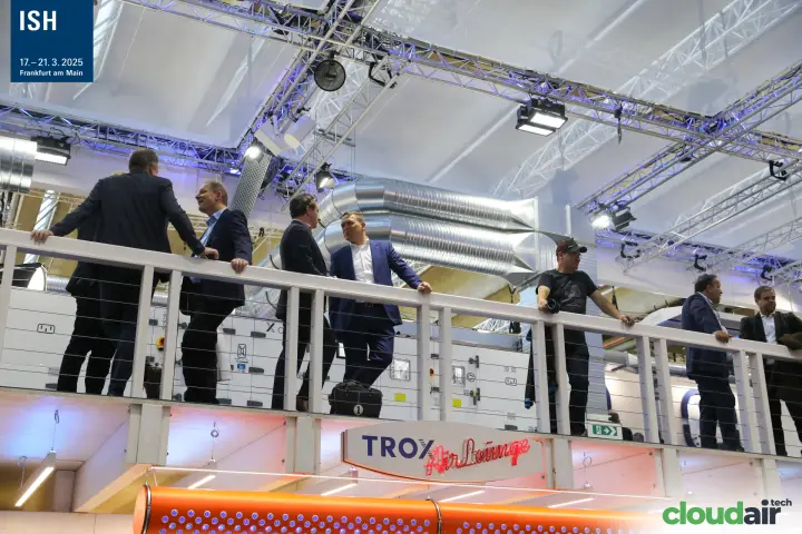 Visitors on the upper deck above the TROX AirLounge sign at ISH 2025
