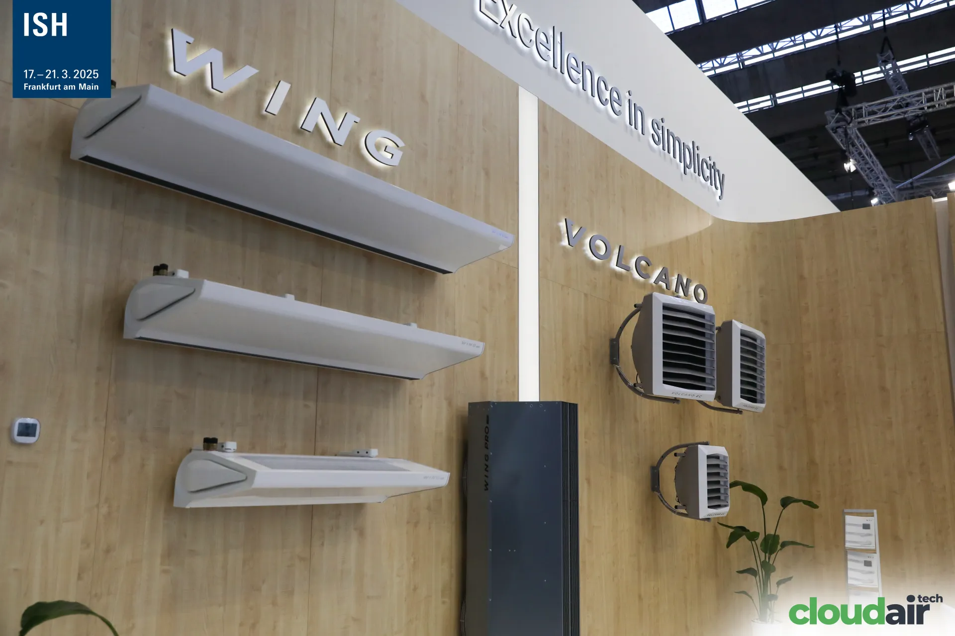 VTS WING air curtains and VOLCANO unit heaters on a wood-panelled wall at ISH 2025