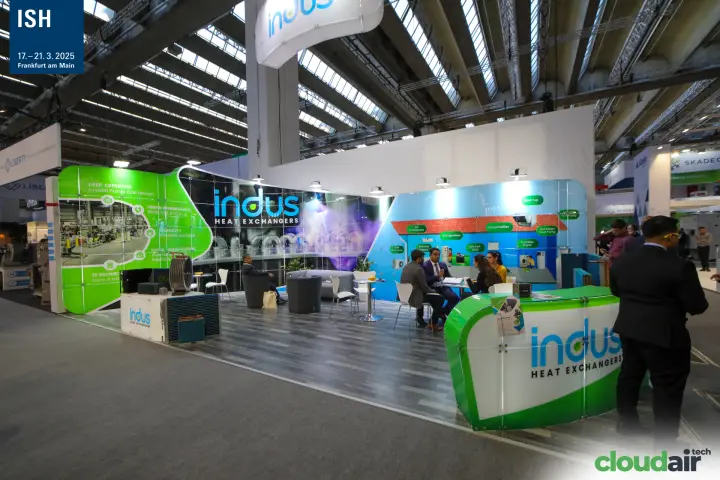 Wide view of the Indus Heat Exchangers stand with green counter at ISH 2025