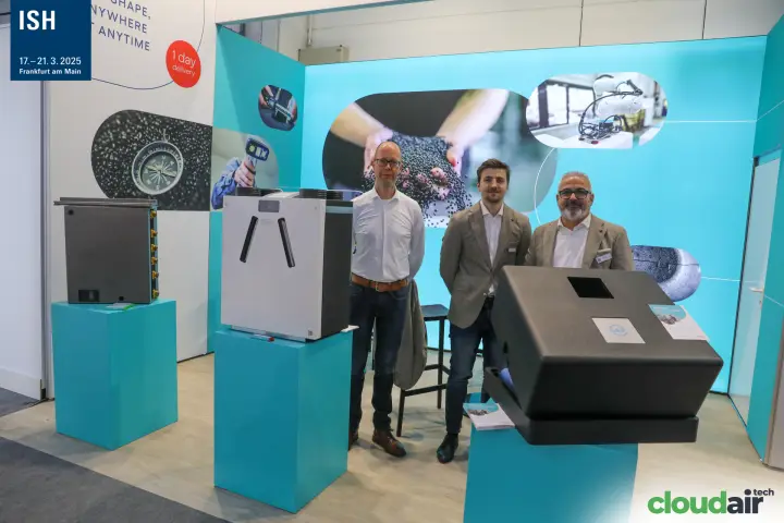 Wide view of the turquoise stand with moulded unit housings and staff