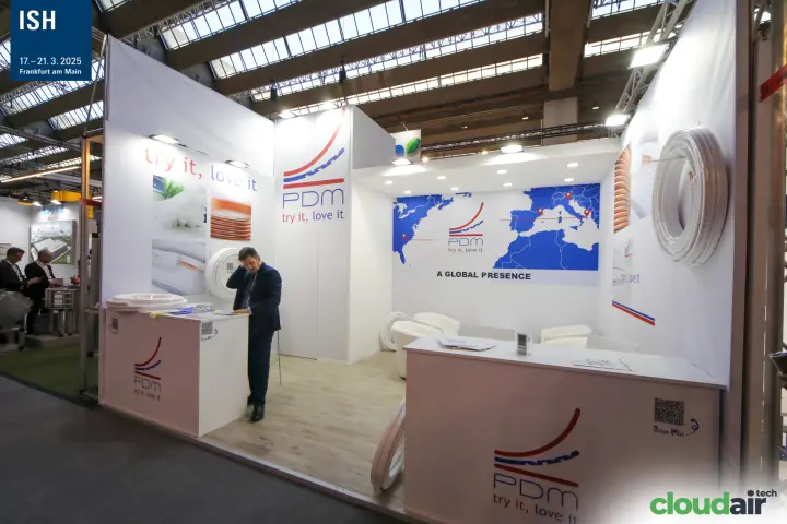 Wide view of the white PDM stand and its "A Global Presence" wall at ISH 2025