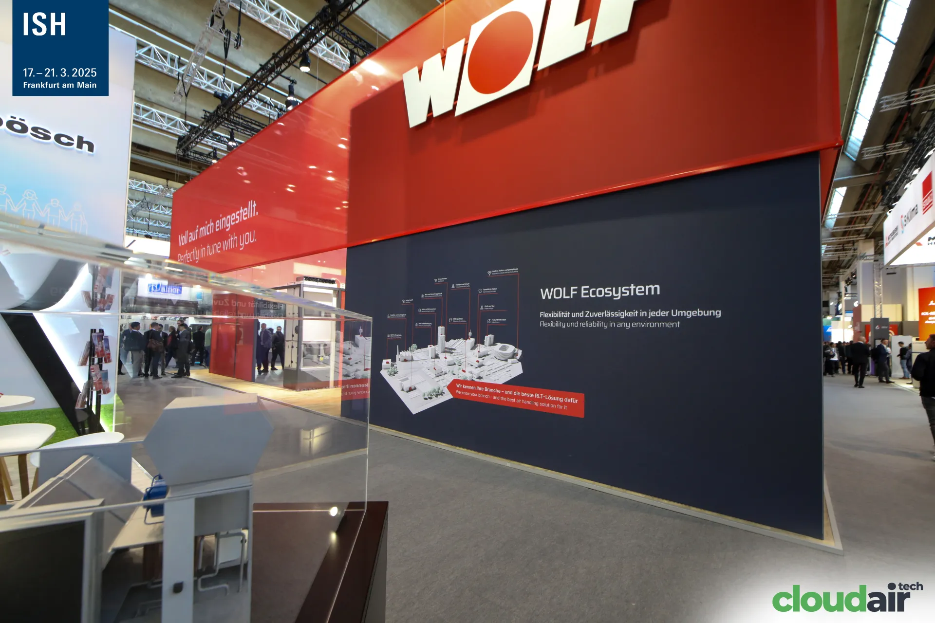 WOLF Ecosystem wall with city model graphic and red fascia at ISH 2025