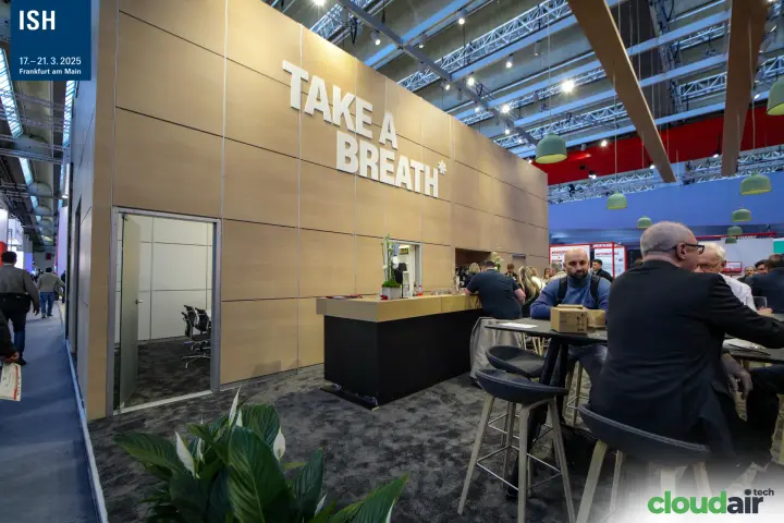 Wood-panelled wall with "Take a Breath*" lettering and stand bar at ISH 2025