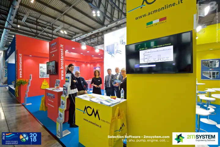 ACM and Brenta Rent staff by the yellow reception desk