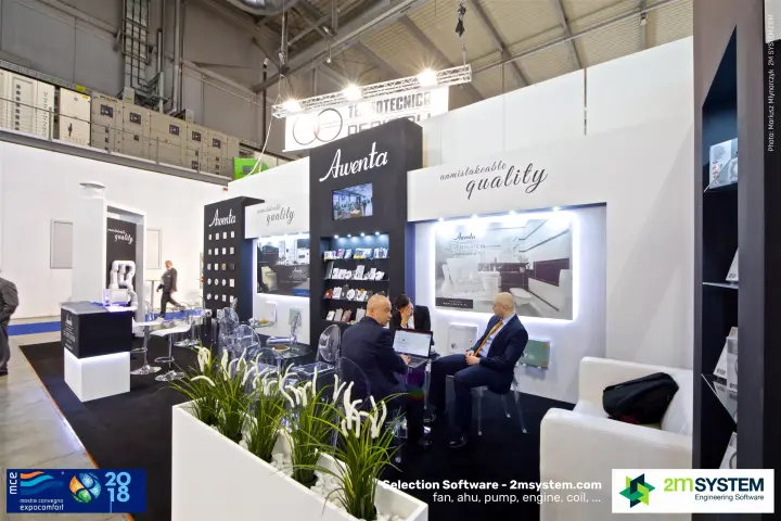Awenta stand seen from the aisle with planter and meeting tables at MCE 2018