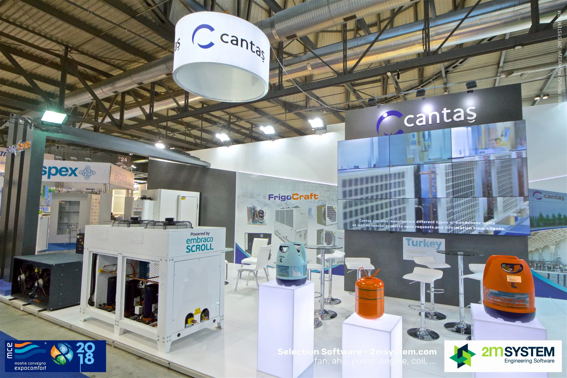 Cantaş video wall and refrigerant cylinders on lit plinths at MCE 2018